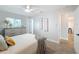 Bright bedroom featuring a window, carpet, and a glimpse into the hallway at 1720 Flamingo Ln, Sun City Center, FL 33573