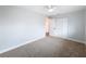 Cozy bedroom with neutral carpet, and a closet with double doors at 1720 Flamingo Ln, Sun City Center, FL 33573