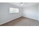 Neutral bedroom with a ceiling fan, carpet, and a window with blinds at 1720 Flamingo Ln, Sun City Center, FL 33573