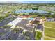 Aerial image showcases a community center with a pool, parking, and recreational areas at 1720 Flamingo Ln, Sun City Center, FL 33573