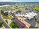 Aerial view of community center with pool, tennis, parking, and recreation areas at 1720 Flamingo Ln, Sun City Center, FL 33573