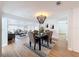 Modern dining room featuring a unique chandelier and an elegant dark wood table at 1720 Flamingo Ln, Sun City Center, FL 33573
