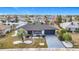 Well maintained front yard with manicured landscaping, decorative rocks, and driveway leading to an attached two-car garage at 1720 Flamingo Ln, Sun City Center, FL 33573