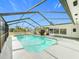 Screened-in pool area with clear blue water, handrail and view of the exterior at 1720 Flamingo Ln, Sun City Center, FL 33573