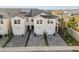 Two-story townhome with solar panels and driveway at 2391 Summerlit St, Lutz, FL 33558