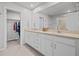 Bathroom with double vanity and walk-in closet at 2391 Summerlit St, Lutz, FL 33558