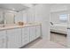 Bathroom with double vanity and shower at 2391 Summerlit St, Lutz, FL 33558