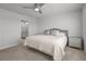 Bright bedroom with king-size bed and ensuite bathroom access at 2391 Summerlit St, Lutz, FL 33558
