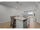Modern kitchen with island and stainless steel appliances at 2391 Summerlit St, Lutz, FL 33558