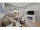 Living room with sectional sofa and electric fireplace at 2391 Summerlit St, Lutz, FL 33558