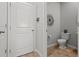 Clean powder room with tile flooring and a pedestal sink at 2391 Summerlit St, Lutz, FL 33558