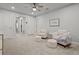 Cozy sitting area with two armchairs and ottomans at 2391 Summerlit St, Lutz, FL 33558