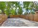 Private backyard with a large paved area and wooden fence at 3424 Queensboro S Ave, St Petersburg, FL 33711