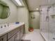 Modern bathroom with double vanity and marble shower at 6 Belleview Blvd # 105, Belleair, FL 33756