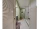 Spa-like bathroom with marble shower and gray vanity at 6 Belleview Blvd # 105, Belleair, FL 33756