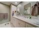 Elegant bathroom with double vanity and marble shower at 6 Belleview Blvd # 105, Belleair, FL 33756