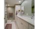 Elegant bathroom with double vanity and updated fixtures at 6 Belleview Blvd # 105, Belleair, FL 33756
