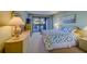 Spacious bedroom with king-size bed and patio access at 6 Belleview Blvd # 105, Belleair, FL 33756