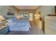 King-size bed in bright bedroom with access to balcony at 6 Belleview Blvd # 105, Belleair, FL 33756