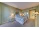 Comfortable bedroom with a queen-size bed and neutral decor at 6 Belleview Blvd # 105, Belleair, FL 33756