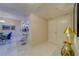 Condo entryway with view into kitchen and dining area at 6 Belleview Blvd # 105, Belleair, FL 33756