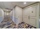 Clean condo hallway with carpet and neutral color palette at 6 Belleview Blvd # 105, Belleair, FL 33756
