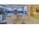 Modern kitchen with breakfast bar and stainless steel appliances at 6 Belleview Blvd # 105, Belleair, FL 33756
