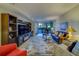 Living room with comfortable seating and access to balcony at 6 Belleview Blvd # 105, Belleair, FL 33756