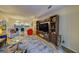 Living room with a comfortable seating arrangement and a large TV at 6 Belleview Blvd # 105, Belleair, FL 33756