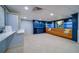 Lobby features comfortable seating, built-in shelving, and a welcoming atmosphere at 6 Belleview Blvd # 105, Belleair, FL 33756
