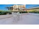 Enjoy dining alfresco on this patio with white wicker furniture at 6 Belleview Blvd # 105, Belleair, FL 33756