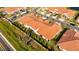 Aerial view showcasing the home's tile roof and backyard at 17554 Holly Well Ave, Wimauma, FL 33598