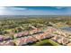 Aerial view of home and surrounding neighborhood at 17554 Holly Well Ave, Wimauma, FL 33598