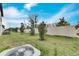 Landscaped backyard with a privacy fence at 17554 Holly Well Ave, Wimauma, FL 33598