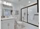 Clean bathroom with white vanity and tub/shower combo at 17554 Holly Well Ave, Wimauma, FL 33598