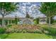Medley Clubhouse sign, beautiful landscaping at 17554 Holly Well Ave, Wimauma, FL 33598