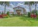 Community clubhouse with landscaped grounds and inviting entrance at 17554 Holly Well Ave, Wimauma, FL 33598