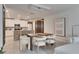 Modern dining room with view of kitchen at 17554 Holly Well Ave, Wimauma, FL 33598