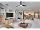 Open living area with built-in shelving and white sectional at 17554 Holly Well Ave, Wimauma, FL 33598