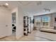 Bright loft area with comfy seating and built-in shelving at 17554 Holly Well Ave, Wimauma, FL 33598