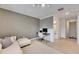 Spacious loft with desk, seating and view of staircase at 17554 Holly Well Ave, Wimauma, FL 33598