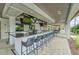 Outdoor bar with seating and multiple TVs at 17554 Holly Well Ave, Wimauma, FL 33598