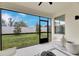 Spacious screened-in patio overlooking the backyard at 17554 Holly Well Ave, Wimauma, FL 33598
