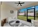 Relaxing screened patio with fire pit and outdoor seating at 17554 Holly Well Ave, Wimauma, FL 33598