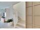 Modern staircase with white railing and light wood flooring at 17554 Holly Well Ave, Wimauma, FL 33598