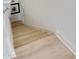 Light wood stairs leading to upper level at 17554 Holly Well Ave, Wimauma, FL 33598
