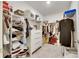 Spacious walk-in closet with ample shelving and hanging space at 17554 Holly Well Ave, Wimauma, FL 33598