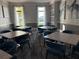 Community clubhouse meeting room with tables and chairs at 17702 Cresswind Ter, Bradenton, FL 34211
