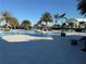 Community pool with lounge chairs and palm trees at 17702 Cresswind Ter, Bradenton, FL 34211