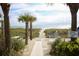 Private beach access with boardwalk path to sandy shore at 3806 Gulf Of Mexico Dr # C211, Longboat Key, FL 34228
